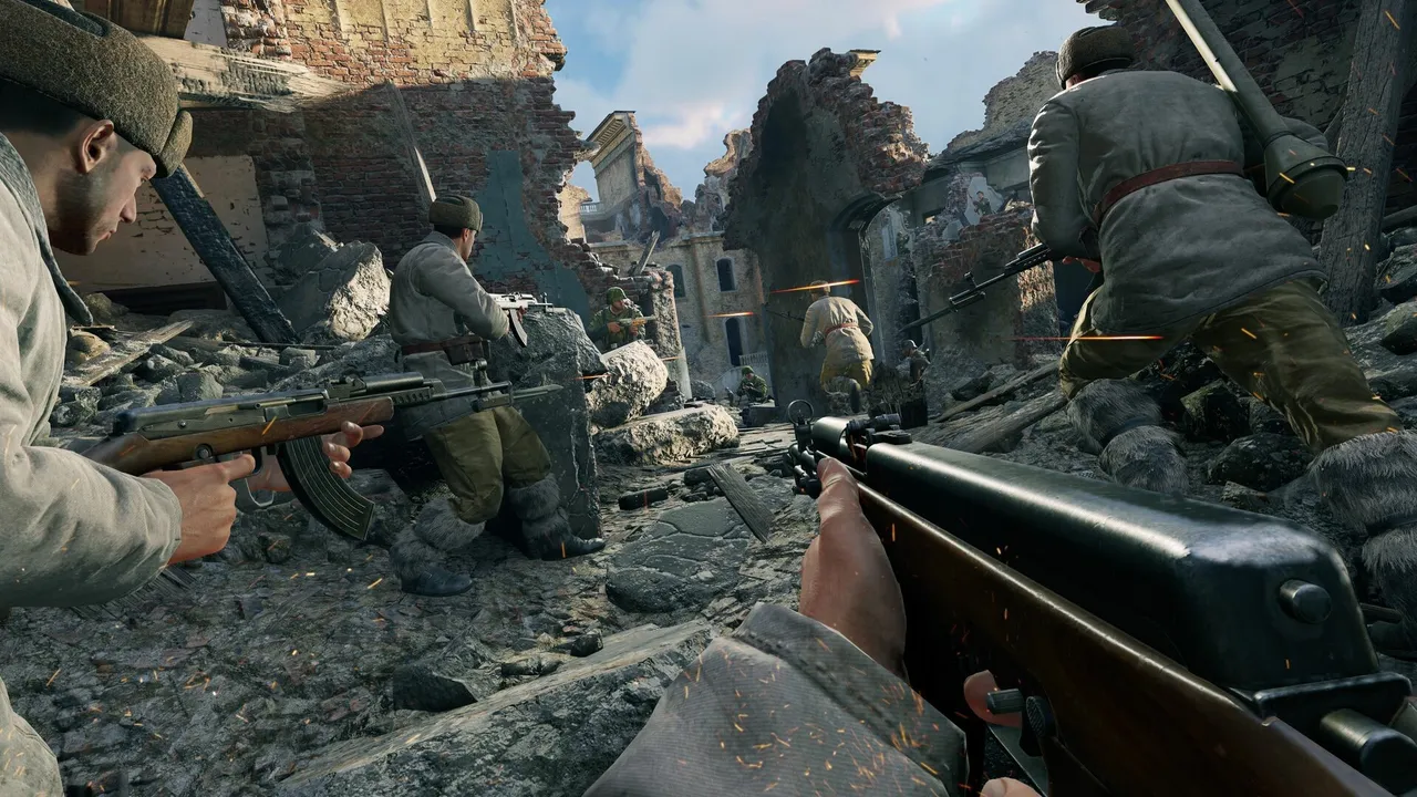 Enlisted official screenshot: a first-person view of a rifleman advancing with his squad through rubble